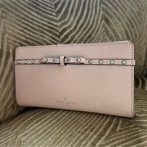 Chic Kate spade bifold leather wallet in pink with bow detailing